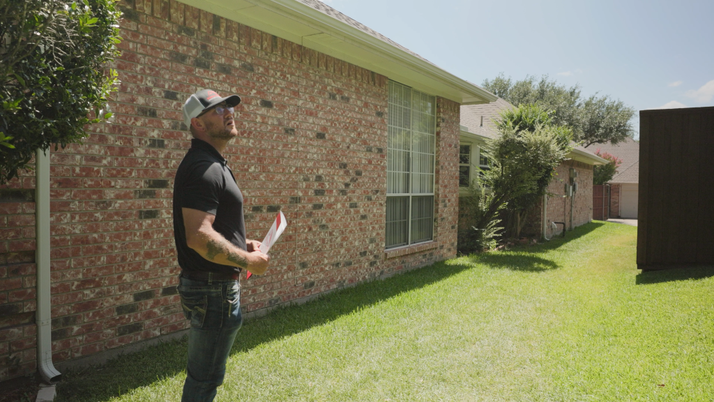 Max beginning a roof inspection fro the ground in Richardson, TX