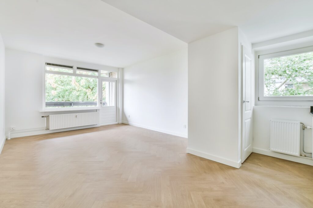 Bright room with finished parquet flooring