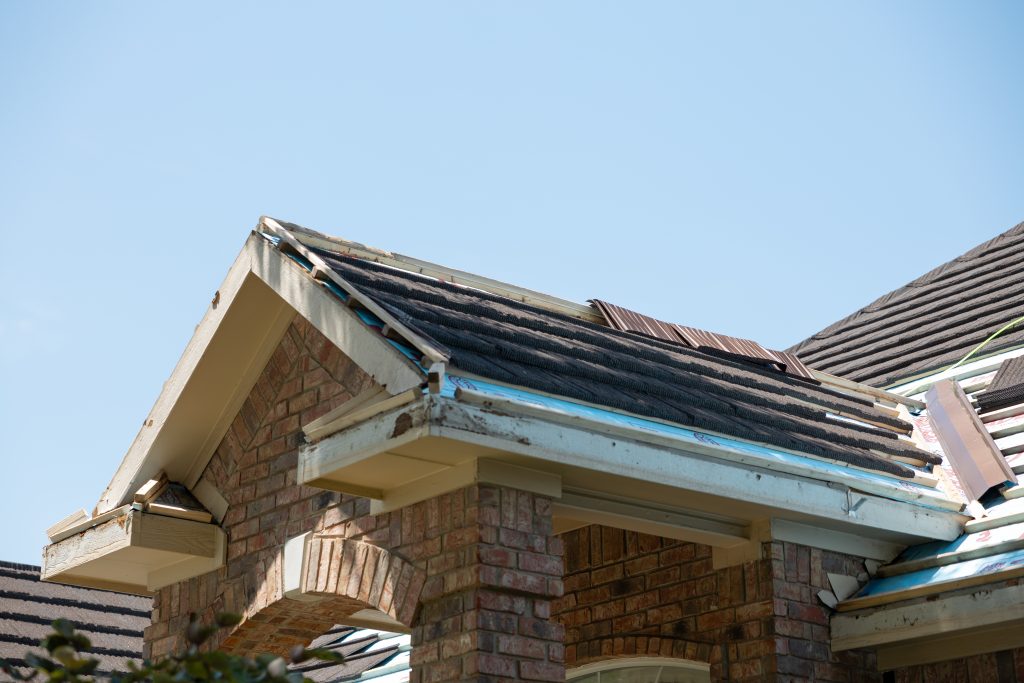 Damaged and rotting fascia boards on a house in Richardson, Texas.