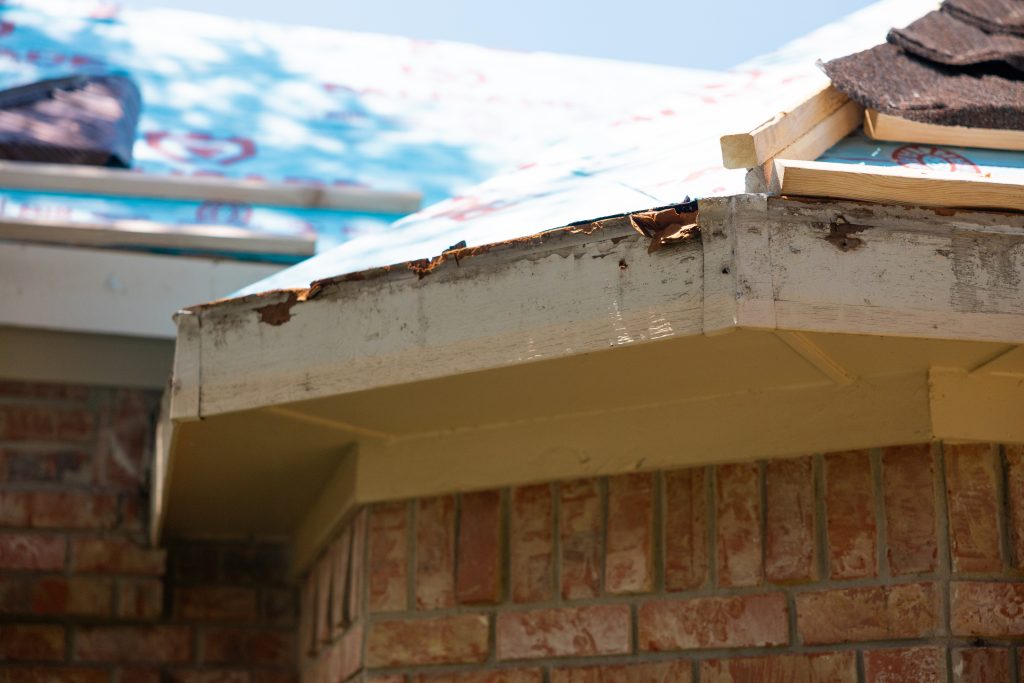 Damaged and rotting fascia boards on a house in Richardson, Texas.
