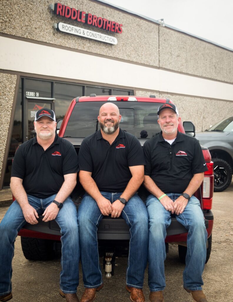 The Riddle brothers outside the Riddle Brothers Roofing and Construction shop in Rowlett, Texas