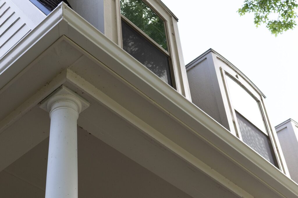 Seamless gutter and fascia line on a covered porch in North Texas