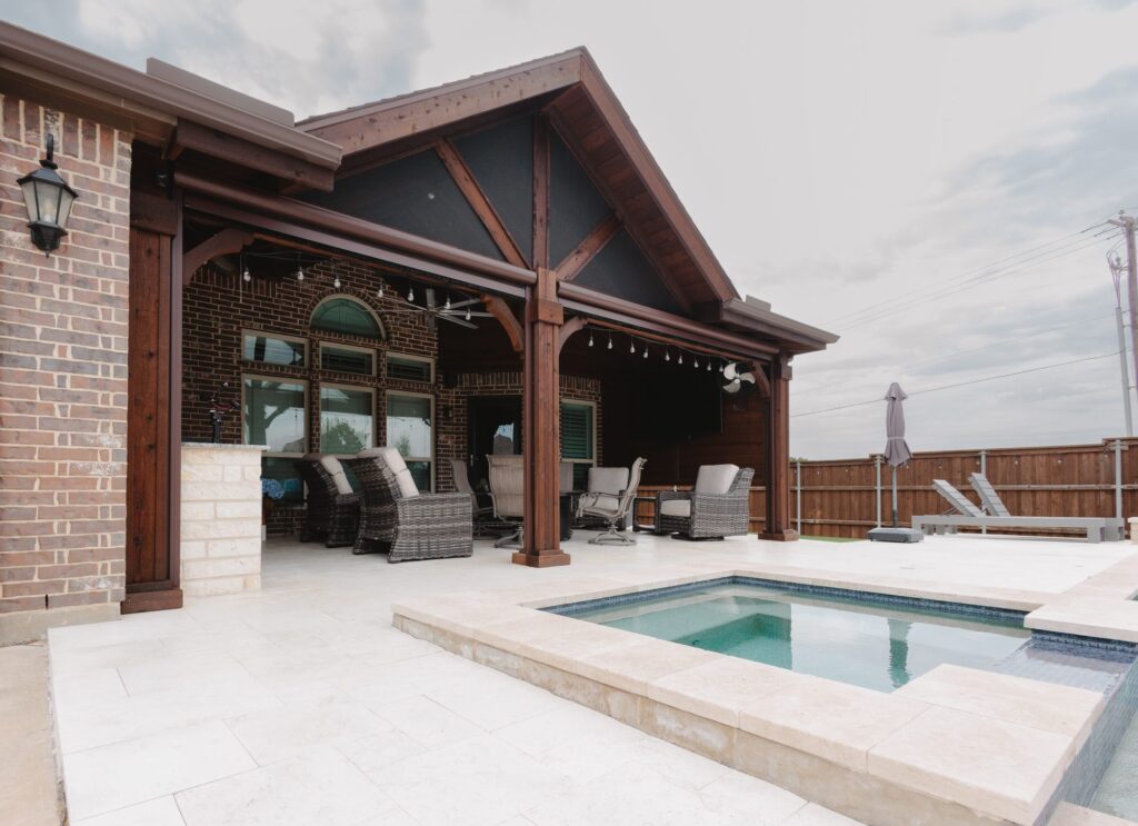 Custom covered patio and pool built by Riddle Brothers