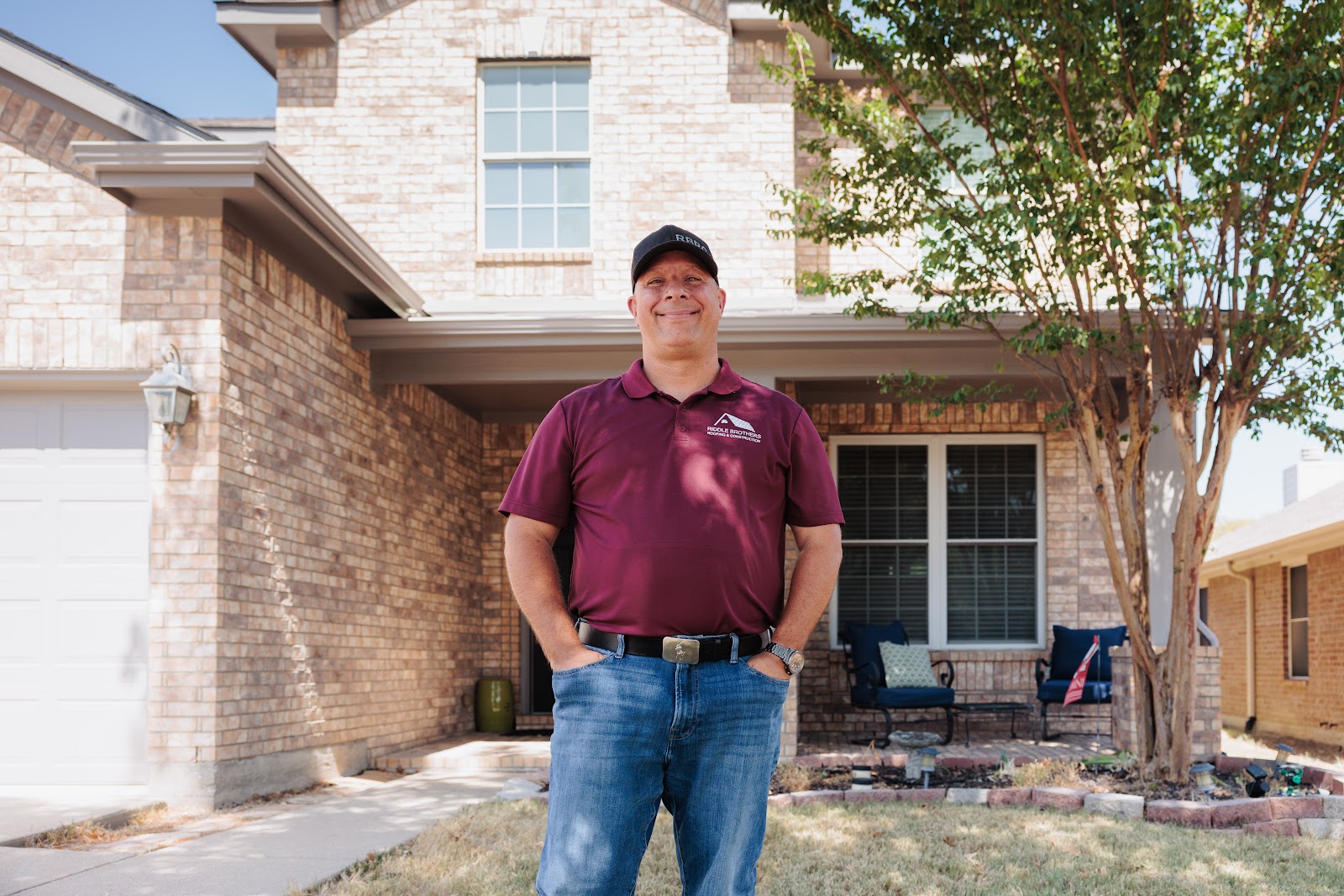 Tony from Riddle Brothers in front of a finished roof replacement in Wylie, Texas (by Riddle Brothers Roofing & Construction)